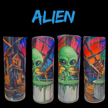 Four tall cylindrical glasses with colorful alien-themed artwork, shown against a black background with the word 'ALIEN' in blue at the top. The designs feature green aliens, paint drips, and abstract red, blue, and orange backgrounds.